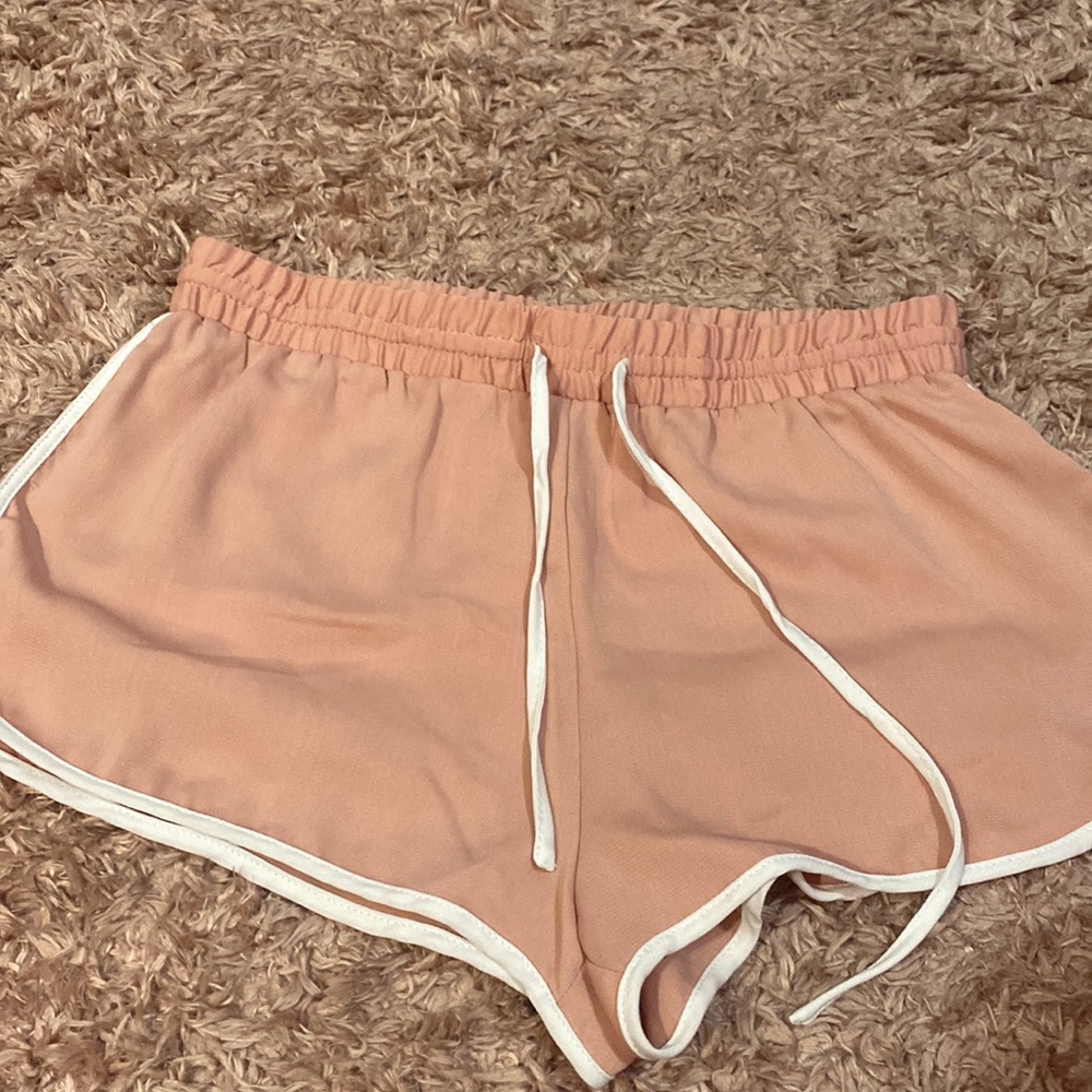 Pink short shorts.